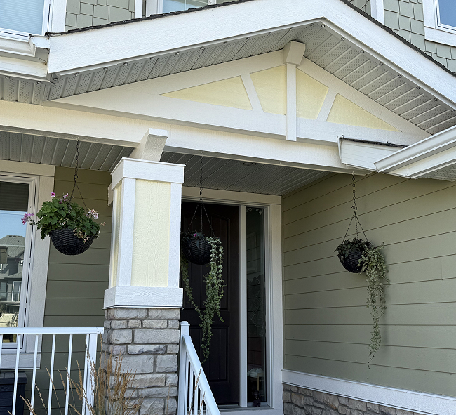 Freshly painted home exterior with white trim in Chestermere, Alberta