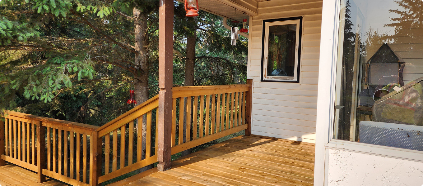 Stained cedar deck and porch exterior — The Birds Stain, Chestermere Alberta